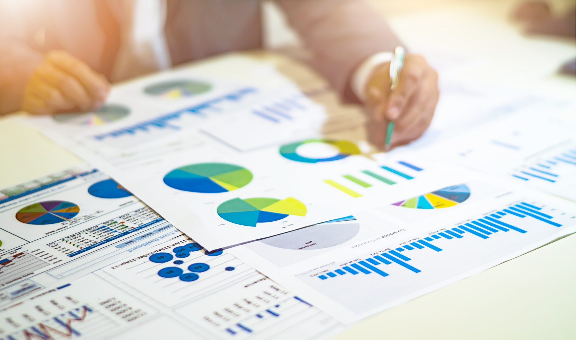 Business people analysis data graph and charts on table