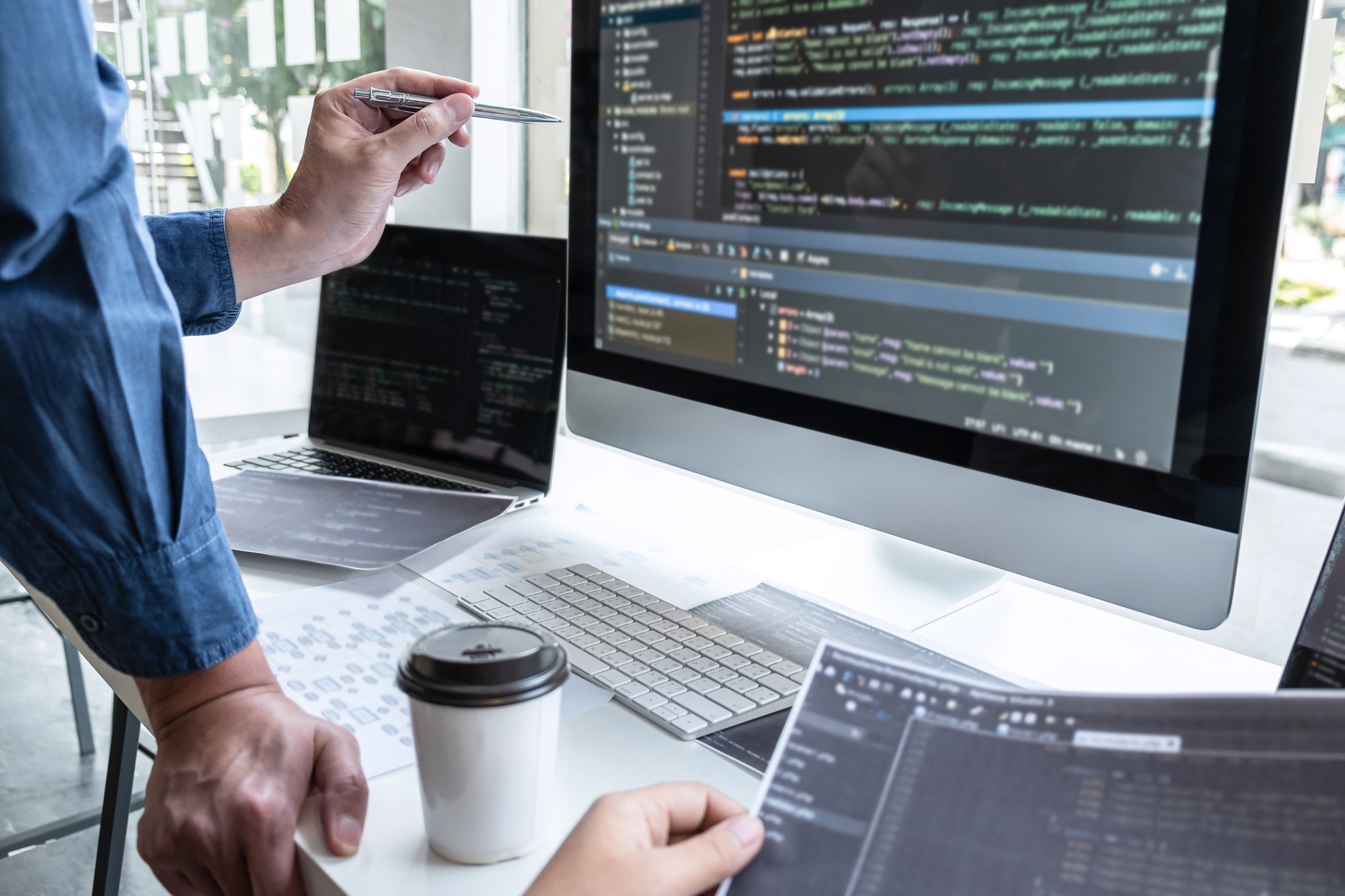 Team of developer programmer working on project in software development computer in IT company